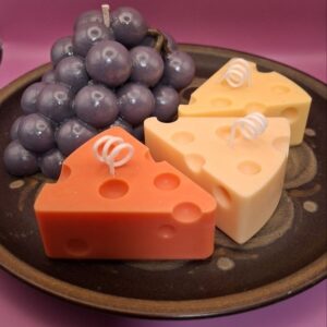 Candle Cheese and grapes on the plate